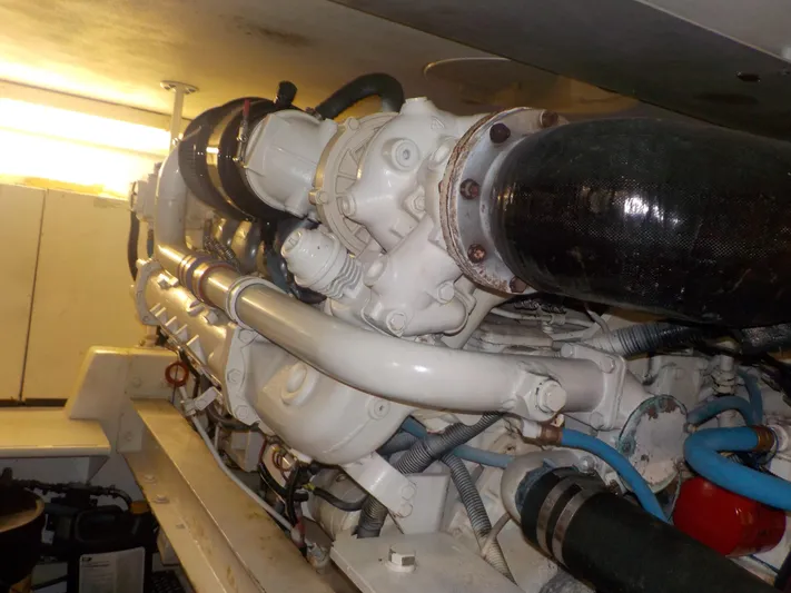 Tiramisu Yacht Photos Pics Engine room of 1996 Viking 47 Convertible yacht, showcasing detailed machinery and components.