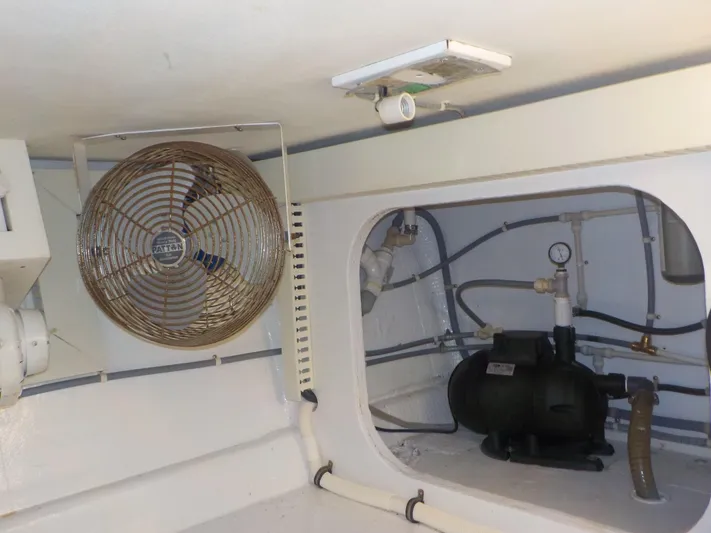 Tiramisu Yacht Photos Pics Engine room of 1996 Viking 47 Convertible yacht with fan and plumbing.
