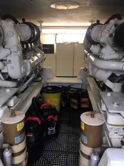 Tiramisu Yacht Photos Pics Engine room of 1996 Viking 47 Convertible yacht, featuring dual engines and maintenance equipment.