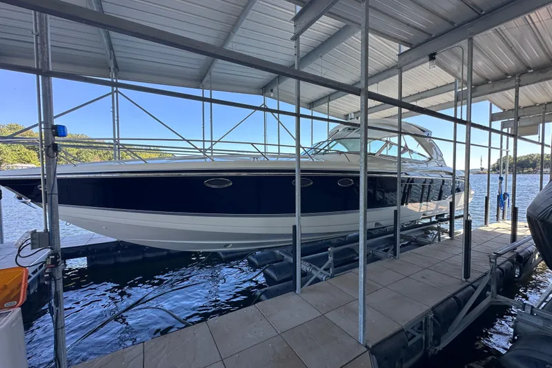  Yacht Photos Pics 2007 Formula 400 Super Sport boat docked under a covered marina.