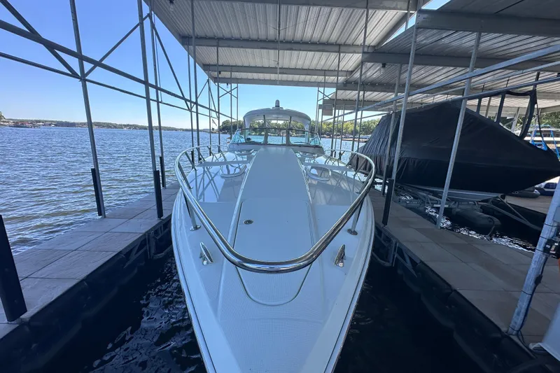  Yacht Photos Pics 2007 Formula 400 Super Sport boat docked under a covered marina.