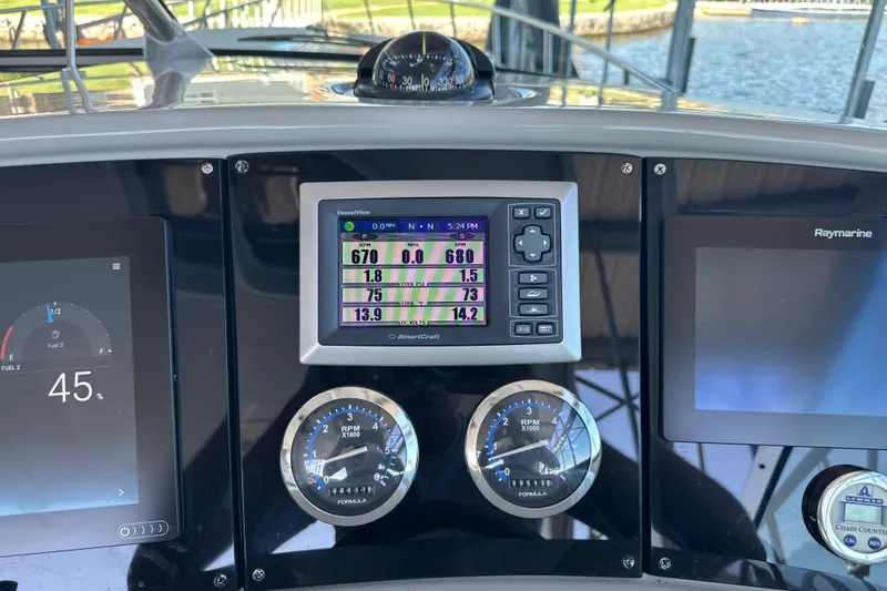  Yacht Photos Pics Dashboard of a 2007 Formula 400 Super Sport boat with navigation instruments.