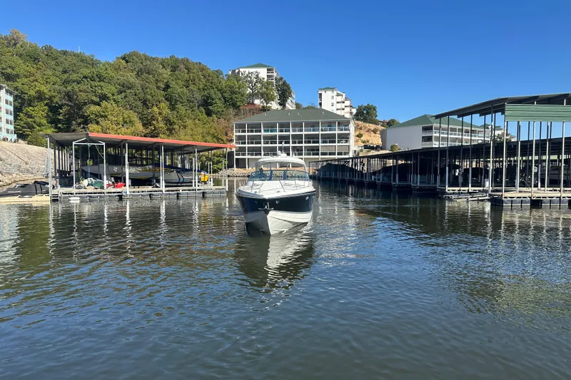  Yacht Photos Pics 2007 Formula 400 Super Sport boat docked at a marina with surrounding buildings.