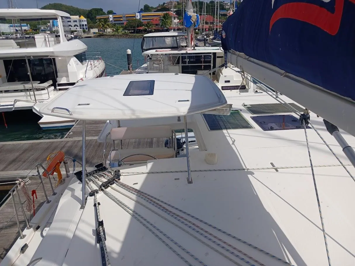 2021 Leopard 40 catamaran docked at marina, showcasing deck and sail details.