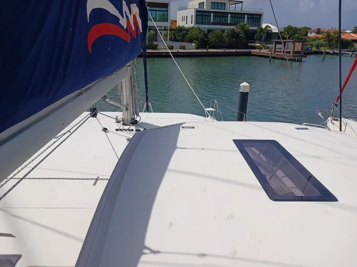 Bendigo Yacht Photos Pics Sailing catamaran Leopard 40, 2021 model, docked in a serene marina setting.