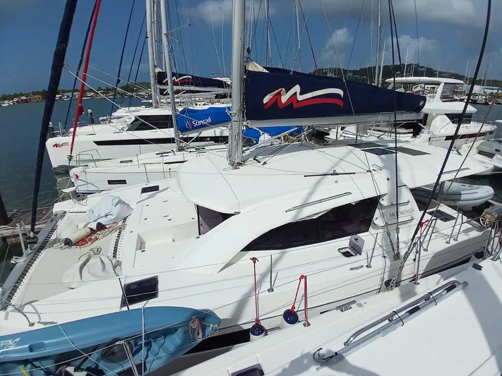 Bendigo Yacht Photos Pics Sailboats docked at marina, featuring a 2021 Leopard 40 model under clear skies.