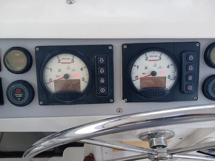 Bendigo Yacht Photos Pics Control panel of a 2021 Leopard 40 boat with gauges and steering wheel.