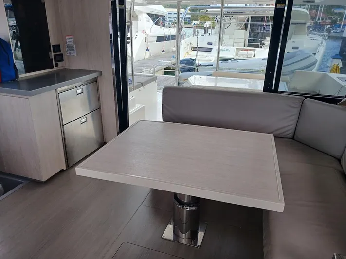 Bendigo Yacht Photos Pics Interior of 2021 Leopard 40 yacht with modern dining area and marina view.