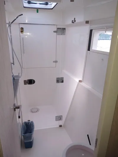 Bendigo Yacht Photos Pics Bathroom interior of 2021 Leopard 40 catamaran, featuring shower and window.