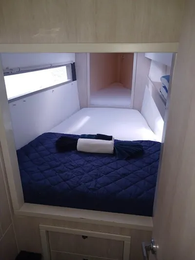 Bendigo Yacht Photos Pics Cozy cabin interior of 2021 Leopard 40 catamaran with neatly arranged bedding.