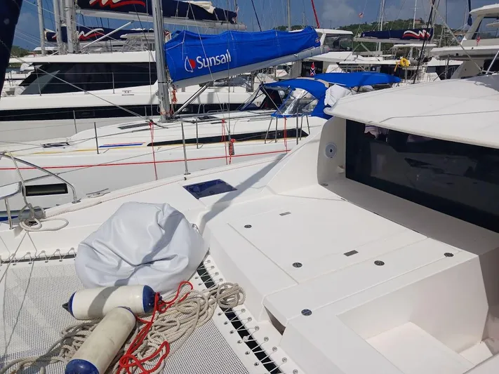 Bendigo Yacht Photos Pics Leopard 40 catamaran, 2021 model, docked with other sailboats, featuring deck and ropes.