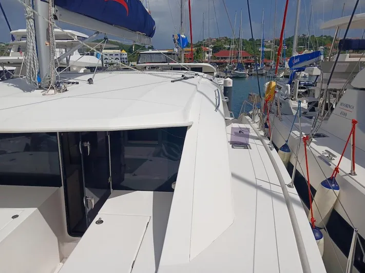 Bendigo Yacht Photos Pics 2021 Leopard 40 catamaran docked in a marina, surrounded by other boats.