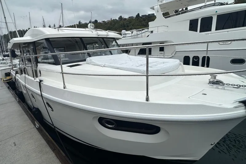 Fret Knot Yacht Photos Pics 2024 Beneteau Swift Trawler 41 Sedan docked at marina, showcasing sleek design.
