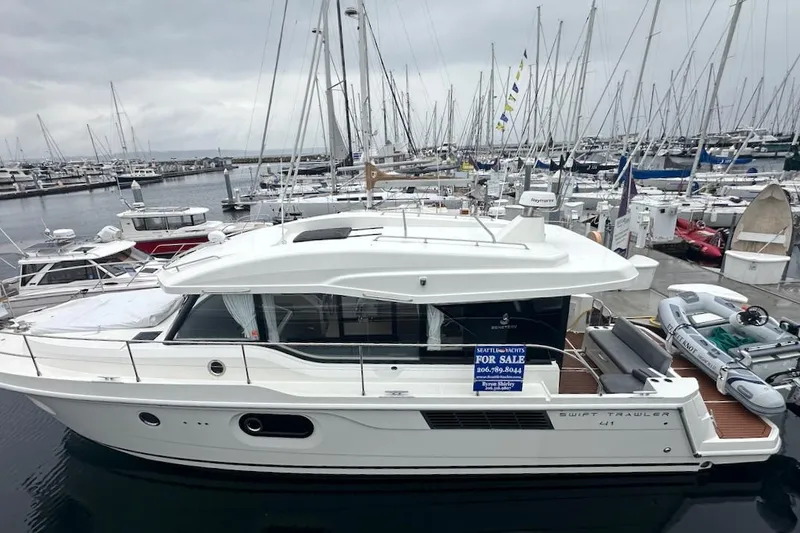 Fret Knot Yacht Photos Pics 2024 Beneteau Swift Trawler 41 Sedan for sale at marina, side view.