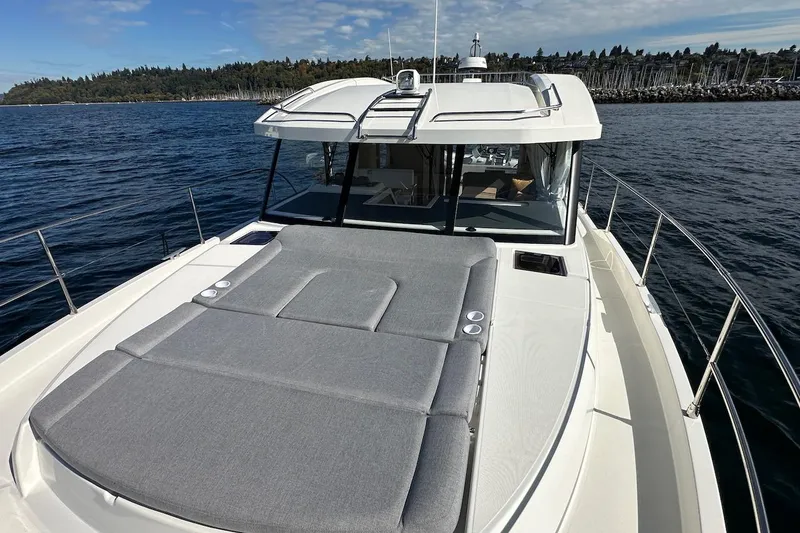 Fret Knot Yacht Photos Pics 2024 Beneteau Swift Trawler 41 Sedan on water, featuring spacious deck and sleek design.