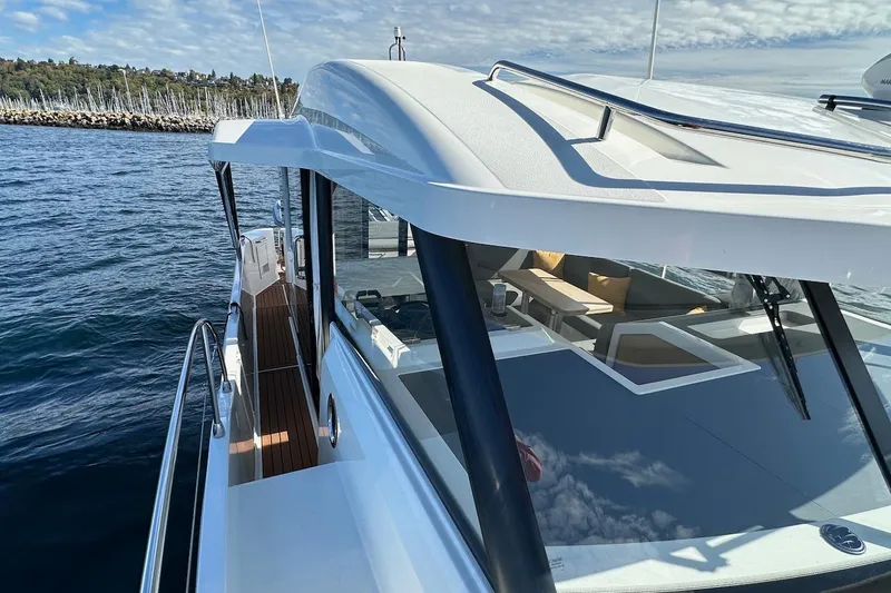 Fret Knot Yacht Photos Pics 2024 Beneteau Swift Trawler 41 Sedan on water, showcasing sleek design and spacious deck.