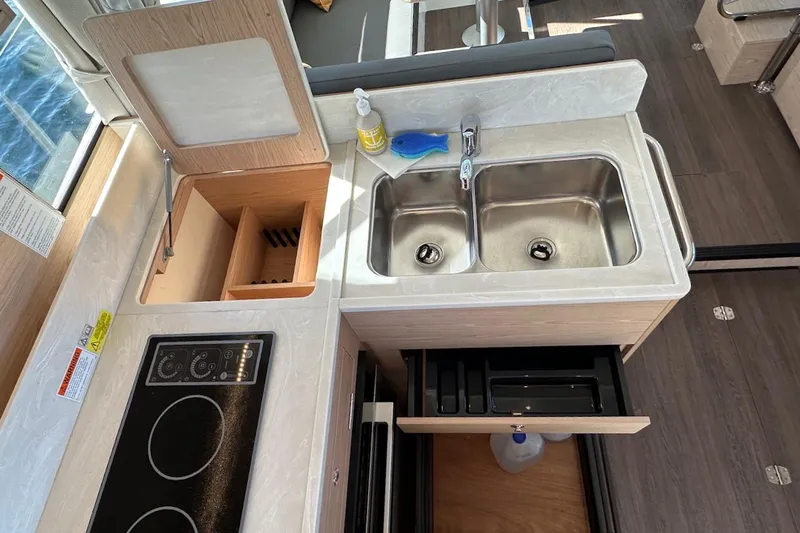 Fret Knot Yacht Photos Pics 2024 Beneteau Swift Trawler 41 Sedan kitchen with dual sink and stove.