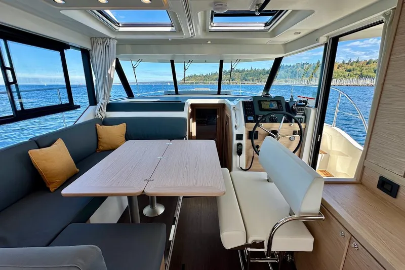 Fret Knot Yacht Photos Pics Interior of 2024 Beneteau Swift Trawler 41 Sedan with ocean view and modern design.