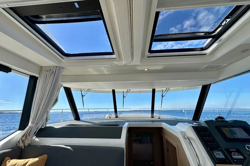 Fret Knot Yacht Photos Pics Interior view of 2024 Beneteau Swift Trawler 41 Sedan with panoramic windows and skylights.