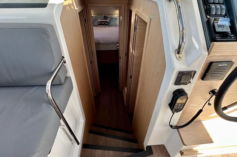Fret Knot Yacht Photos Pics Interior view of 2024 Beneteau Swift Trawler 41 Sedan, featuring stairs and cabin entrance.