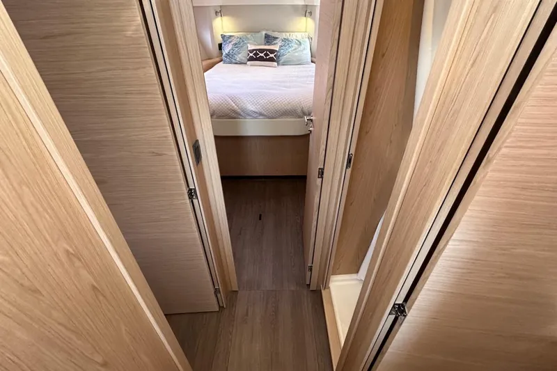 Fret Knot Yacht Photos Pics 2024 Beneteau Swift Trawler 41 Sedan interior with cozy bedroom and wooden finish.