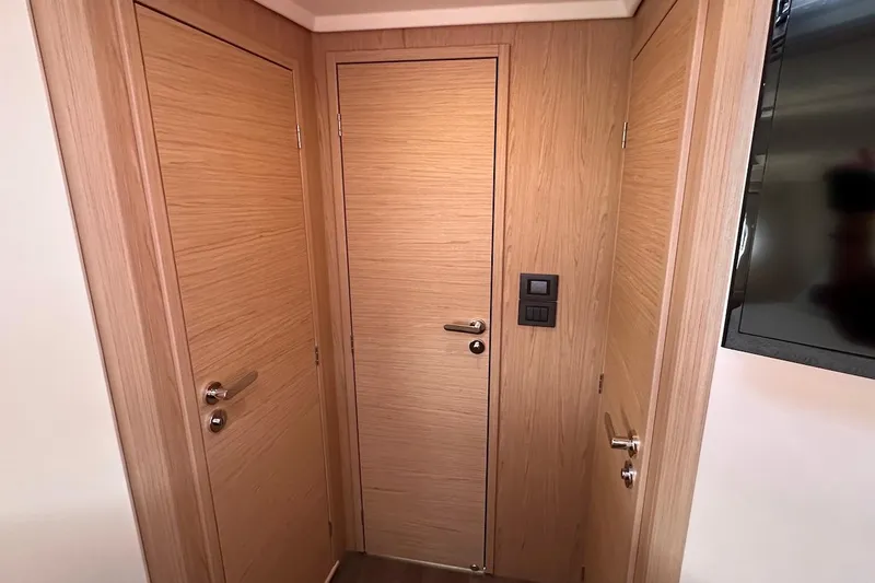 Fret Knot Yacht Photos Pics Interior of 2024 Beneteau Swift Trawler 41 Sedan with wooden doors and modern design.