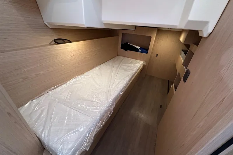 Fret Knot Yacht Photos Pics 2024 Beneteau Swift Trawler 41 Sedan cabin with single bed and wooden interior.