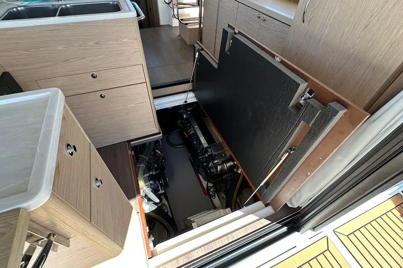 Fret Knot Yacht Photos Pics Engine compartment of 2024 Beneteau Swift Trawler 41 Sedan, showcasing interior design and machinery.