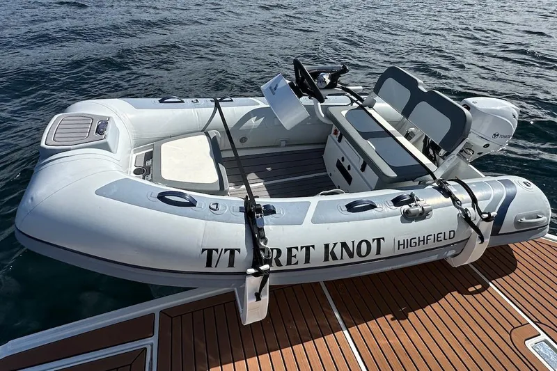 Fret Knot Yacht Photos Pics Highfield inflatable boat docked on water, near Beneteau Swift Trawler 41 Sedan, 2024 model.