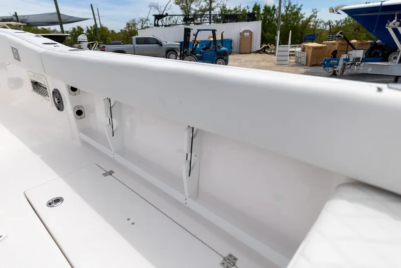  Yacht Photos Pics 2026 Sea Fox 268 Commander boat interior, featuring storage compartments and sleek white design.