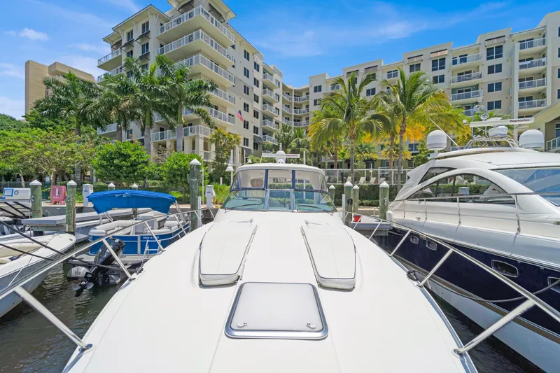 Dream Boat Yacht Photos Pics 2016 Formula 40 PC yacht docked at marina with luxury condos in background.