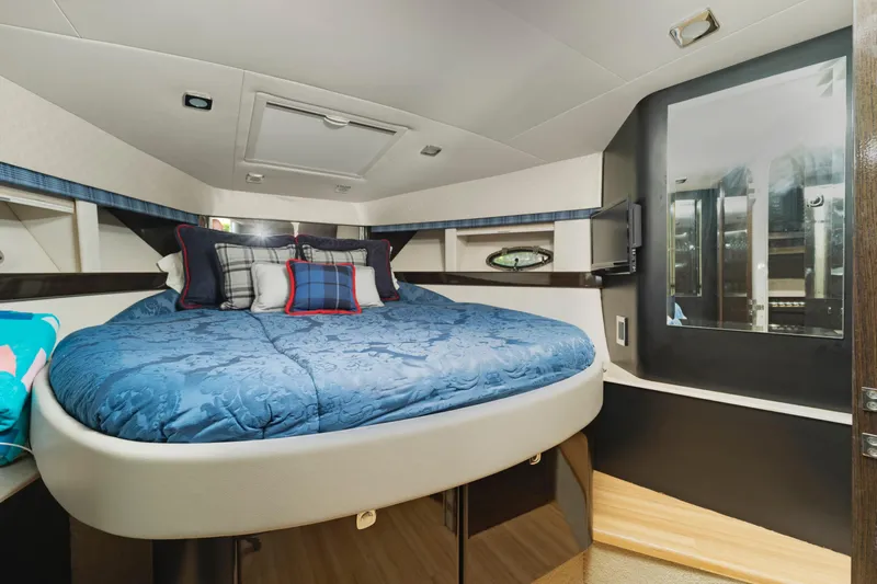 Dream Boat Yacht Photos Pics Luxurious bedroom interior of 2016 Formula 40 PC yacht with blue bedding and modern design.