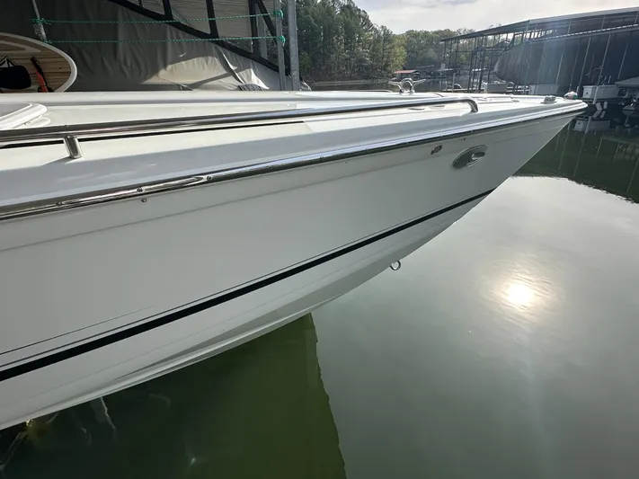  Yacht Photos Pics 2008 Formula 353 FASTech boat docked, reflecting on calm water.
