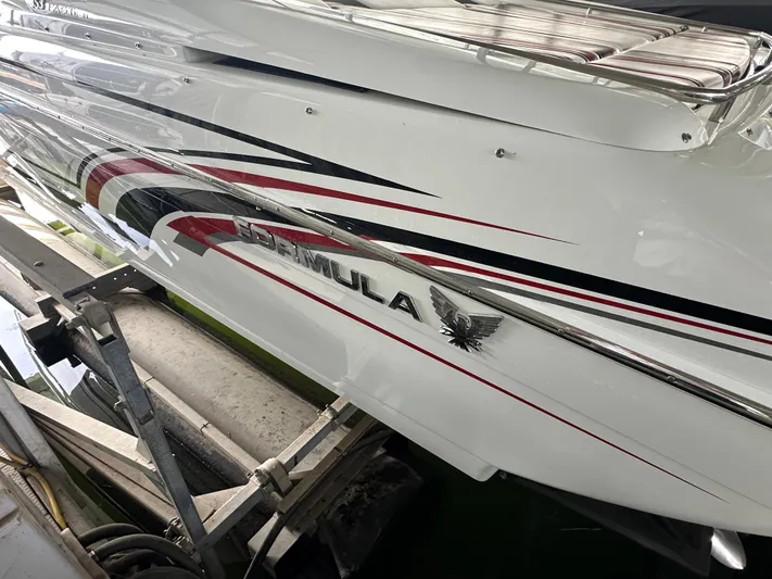  Yacht Photos Pics 2008 Formula 353 FASTech boat with sleek design and bold graphics on a trailer.