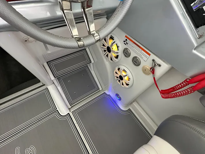  Yacht Photos Pics 2008 Formula 353 FASTech boat interior with steering wheel, speakers, and control panel.