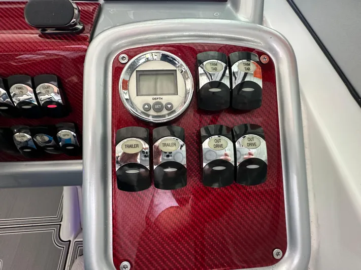  Yacht Photos Pics Control panel of a 2008 Formula 353 FASTech boat with switches and digital display.