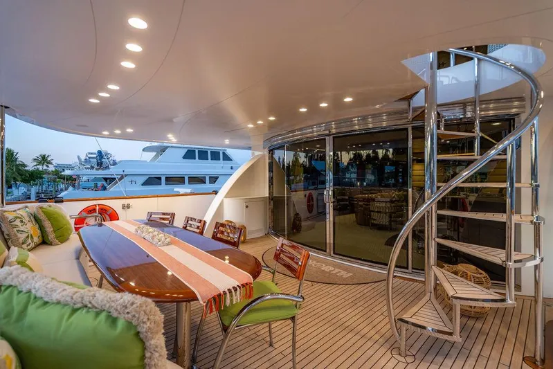 True North Yacht Photos Pics Luxurious 2011 Hargrave Tri Deck yacht with elegant outdoor dining area and spiral staircase.