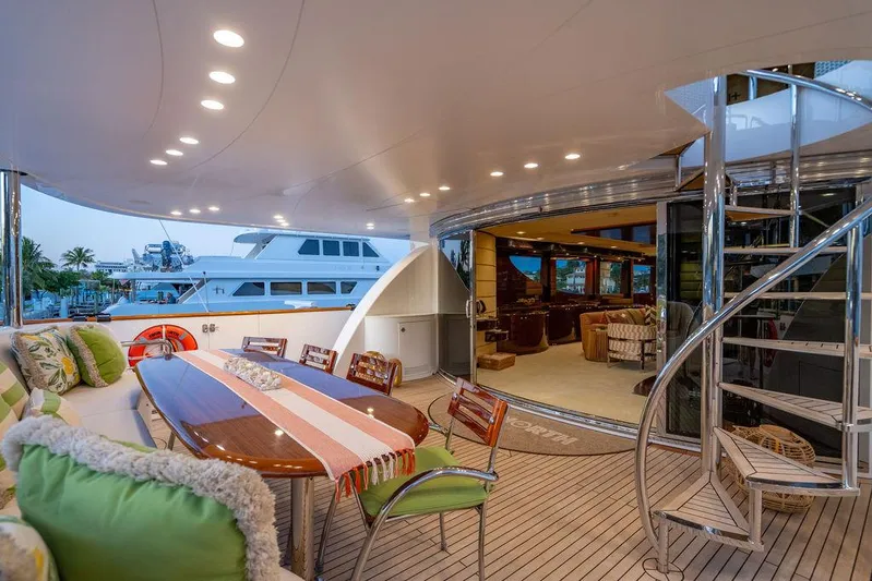 True North Yacht Photos Pics Luxurious 2011 Hargrave Tri Deck yacht with elegant outdoor seating and spiral staircase.