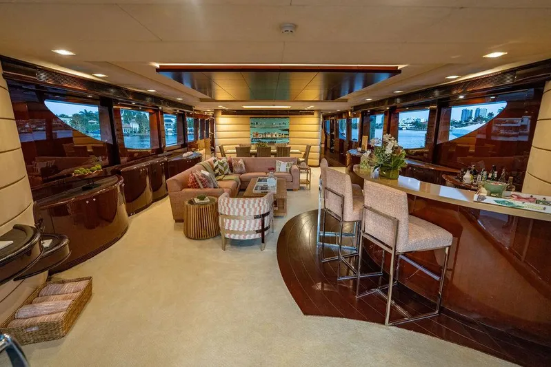 True North Yacht Photos Pics Luxurious interior of 2011 Hargrave Tri Deck yacht with elegant seating and bar area.