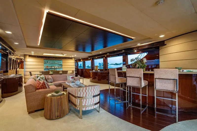 True North Yacht Photos Pics Luxurious interior of 2011 Hargrave Tri Deck yacht with elegant seating and bar area.