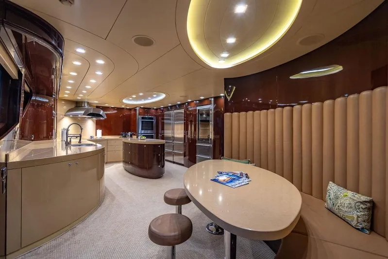 True North Yacht Photos Pics Luxurious interior of 2011 Hargrave Tri Deck yacht with modern kitchen and dining area.