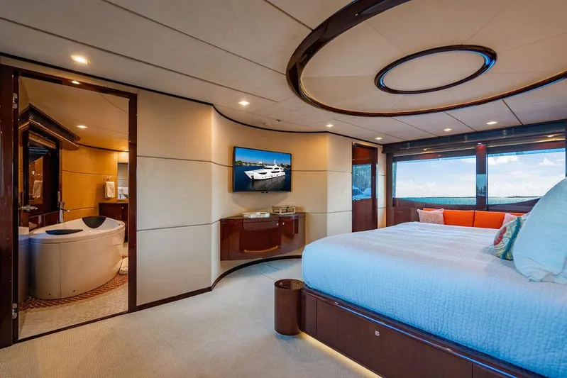 True North Yacht Photos Pics Luxurious bedroom interior of 2011 Hargrave Tri Deck yacht with ensuite bathroom and ocean view.