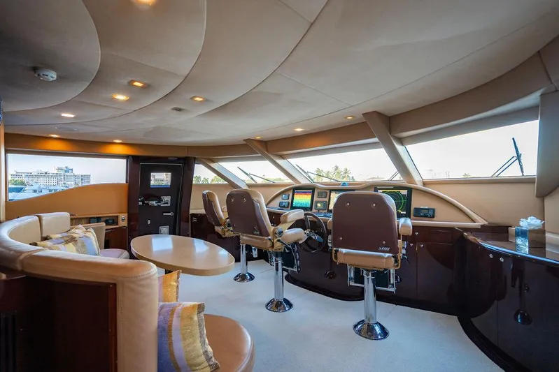 True North Yacht Photos Pics Luxurious interior of 2011 Hargrave Tri Deck yacht with modern helm and seating area.