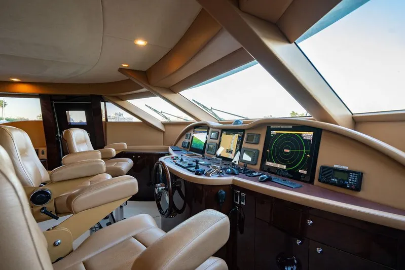 True North Yacht Photos Pics Luxurious 2011 Hargrave Tri Deck yacht cockpit with advanced navigation systems and plush seating.