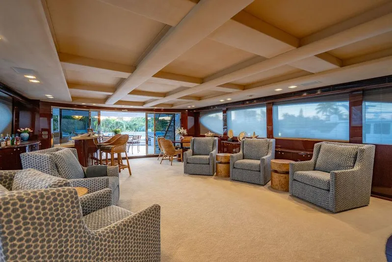 True North Yacht Photos Pics Luxurious interior of 2011 Hargrave Tri Deck yacht with elegant seating and bar area.