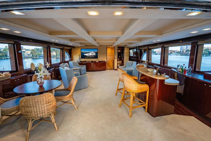 True North Yacht Photos Pics Luxurious interior of 2011 Hargrave Tri Deck yacht with elegant seating and bar area.