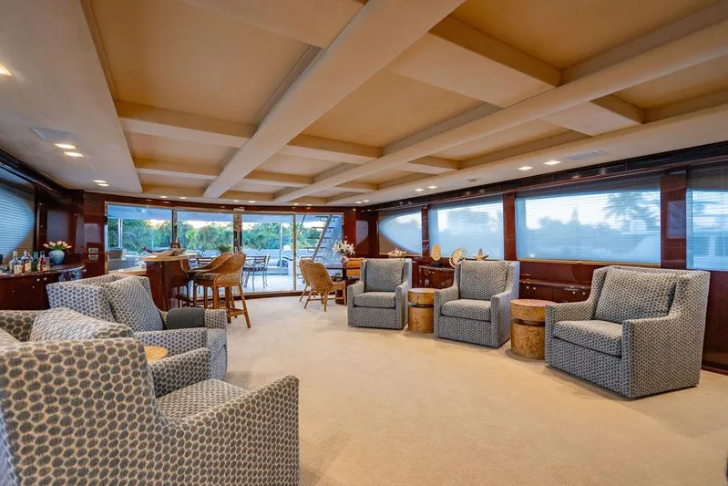 True North Yacht Photos Pics Luxurious interior of 2011 Hargrave Tri Deck yacht with elegant seating and panoramic windows.