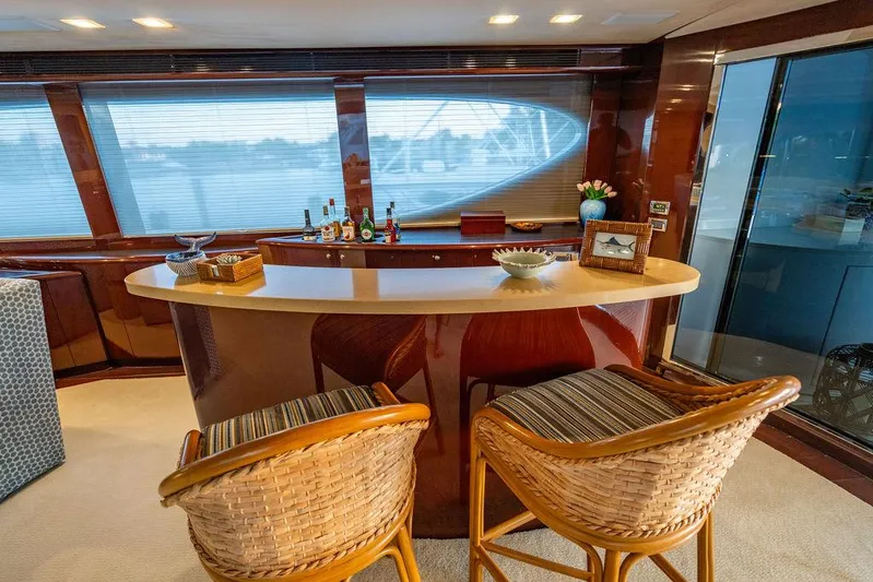True North Yacht Photos Pics Luxurious bar area on 2011 Hargrave Tri Deck yacht with elegant seating and decor.
