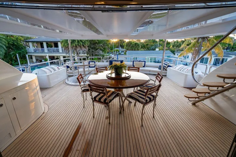 True North Yacht Photos Pics Luxurious 2011 Hargrave Tri Deck yacht with elegant outdoor dining area and scenic views.