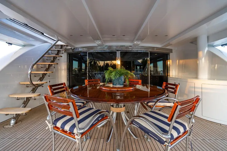 True North Yacht Photos Pics Luxurious 2011 Hargrave Tri Deck yacht dining area with elegant seating and wooden table.
